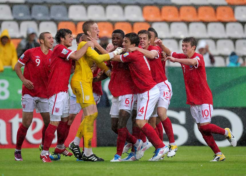 England celebrate shoot-out victory over Argentina.